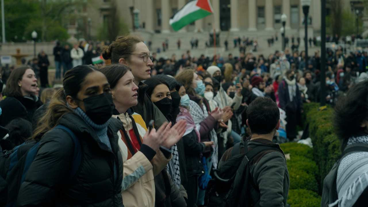 a large crowd of people clapping